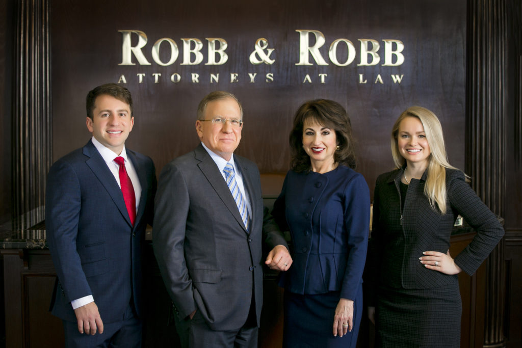 Law firm photo of Robb & Robb LLC consists of (from left) Andrew Robb, Gary Robb, Anita Robb and Brittany Robb